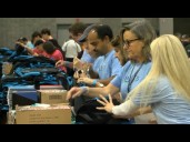 Hundreds of Charlotte-area volunteers stuff backpacks for underprivileged students