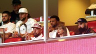 Why is Taylor Swift at a college football game?