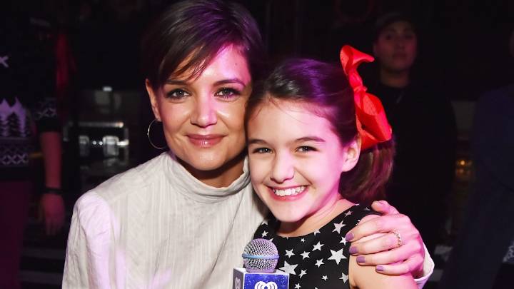 Katie Holmes and daughter Suri team up on movie set as teen flashes kilowatt smile