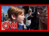 Fifth grader says a friend shielded him as shots were fired during Mass