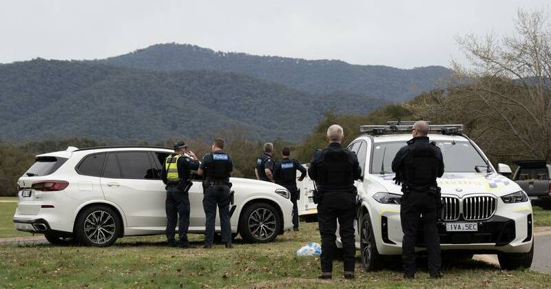 Major search for gunman after police officers shot dead