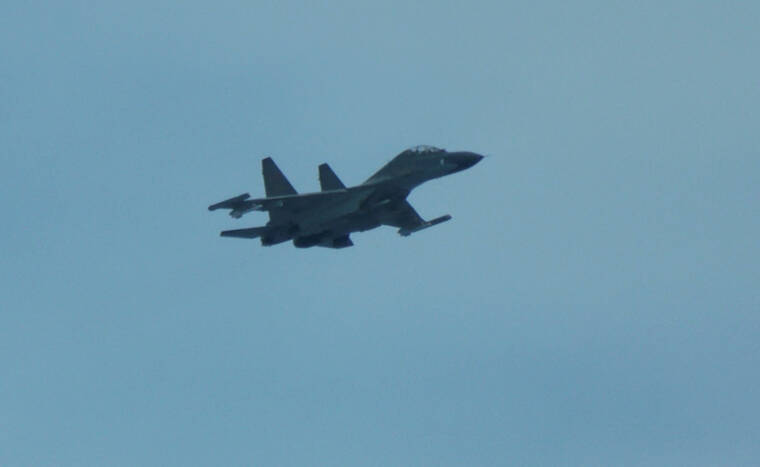 Chinese fighter ‘intercepts’ Philippine plane over disputed shoal, Manila says