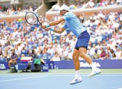 Djokovic battles, Raducanu romps through US Open second round