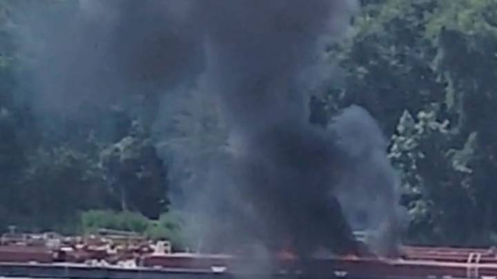 Helicopter crashes into barge killing two after hitting powerlines as burned