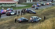 Officer fires gun after nearly being hit by suspect in fleeing vehicle