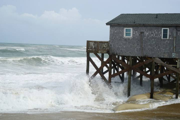 Hurricane Erin stirs up strong winds and floods part of a NC highway as it creeps up the East Coast