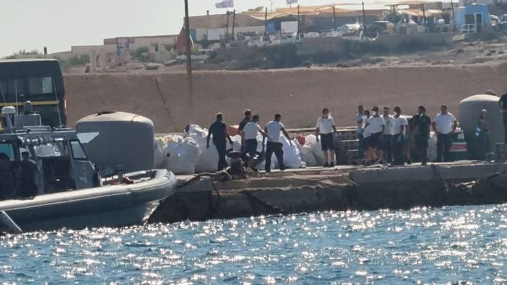 A boat carrying migrants capsizes off Italy, killing at least 26