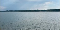 Girl, 11, hit by boat propeller after jumping off pontoon to help another swimmer