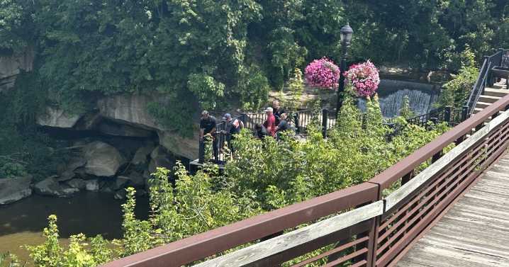 Elyria police searching for missing male in Black River; dive teams responding