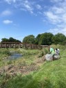 Milwaukee County Parks organize dozens of volunteers to clean up Pulaski Park after flooding