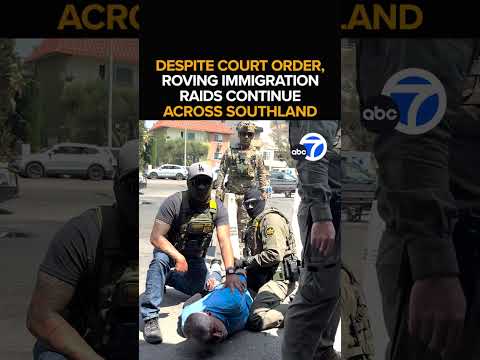 Border patrol agents take man into custody at SoCal car wash