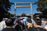 Japan minister joins crowds at controversial shrine to mark 80 years since world war defeat