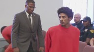 Man accused of shooting his family and then 2 police officers appears in court