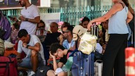 Holiday carnage with thousands left stranded & two dead after gale force winds batter Greece & shut down ferries