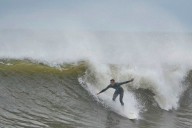 Hurricane Erin still stirring up dangerous waves while it moves away from the East Coast