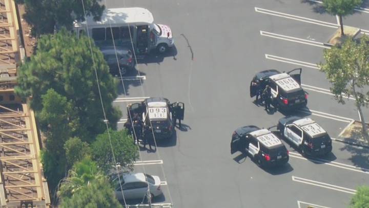 LIVE: Pursuit suspect barricaded in LA Costco parking lot