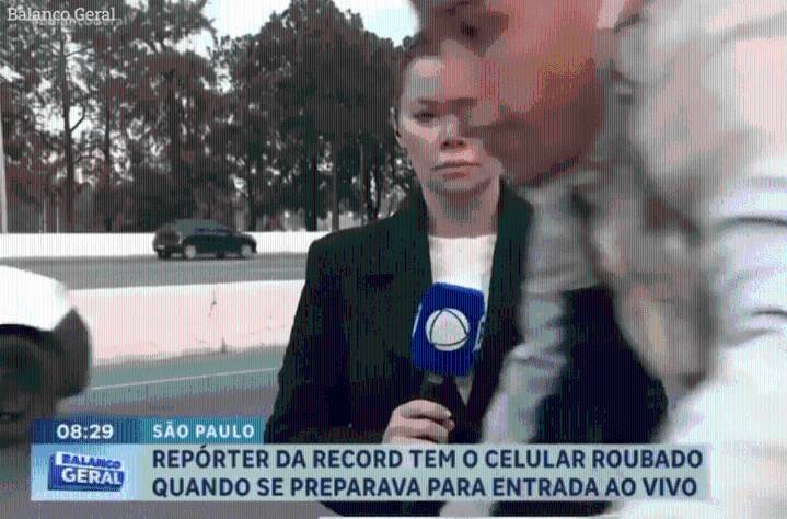 Watch shocking moment TV reporter is ROBBED by bike-riding phone snatcher live on camera