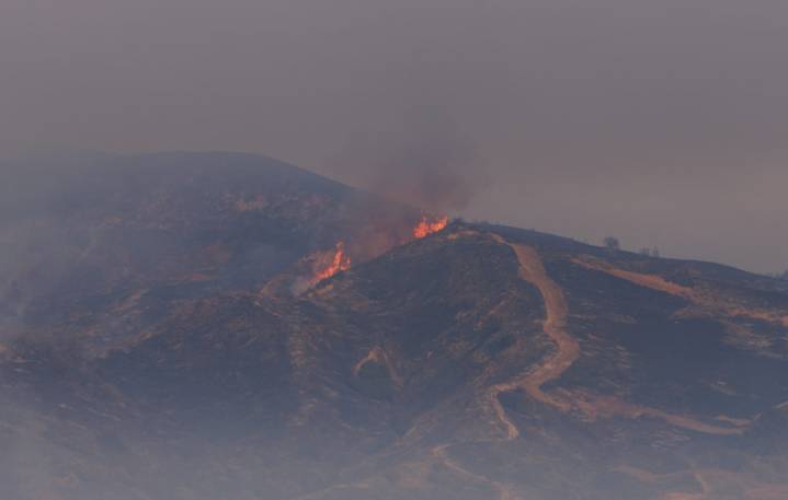 Thousands evacuate from fast-growing brush fire north of Los Angeles
