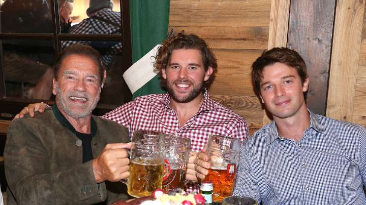 Arnold Schwarzenegger's son Christopher flexes biceps after 30lb weight loss during 'perfect' day with rarely