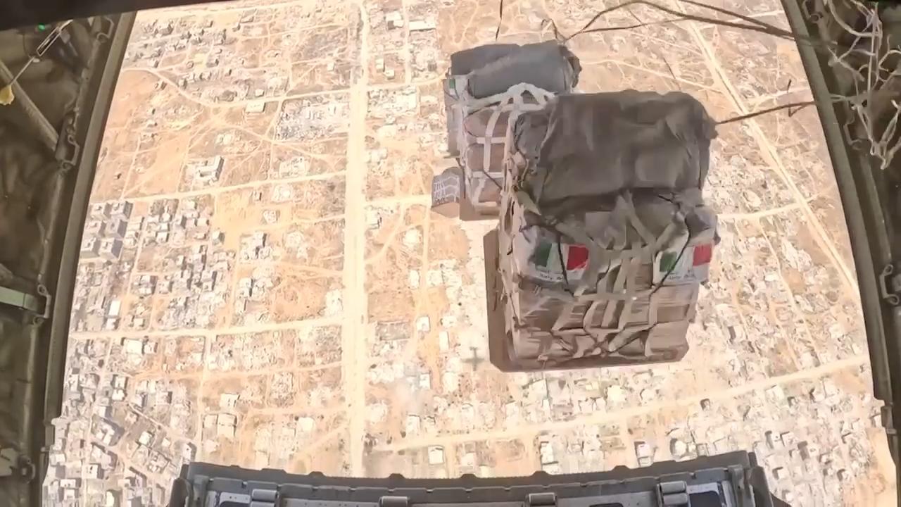 First shipment of humanitarian aid airlifted from Italy to Gaza dropped into the Strip
