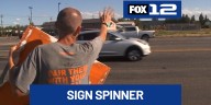 Sign of the times: Beloved Vancouver sign spinner faces layoff, community rallies in support
