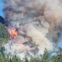 Air quality warnings expand as wildfire burns on south