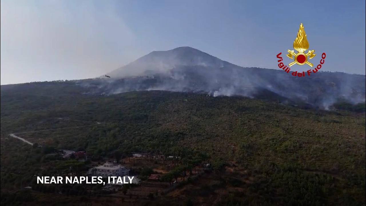 Firefighters continue to battle wildfires on the slopes of Mount Vesuvius near Naples