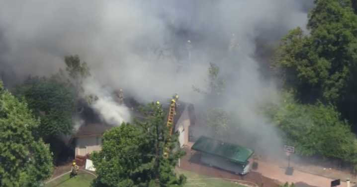 Northridge grass fire burns next to homes, damages 2 sheds