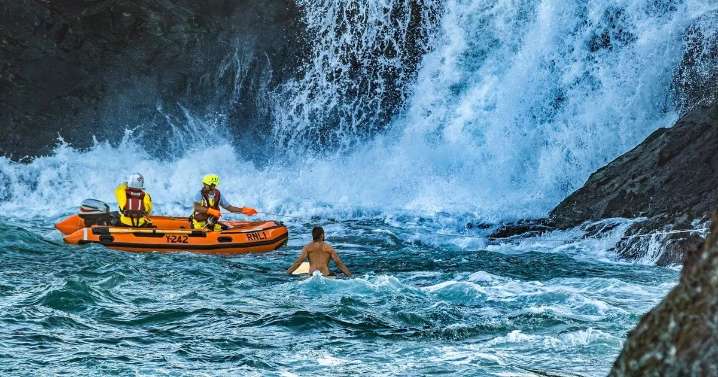 RNLI issues warning to Brits visiting UK seaside after family and dog rescued from rising tide