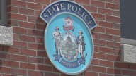 Mother charged after child found dead in vehicle in Milford