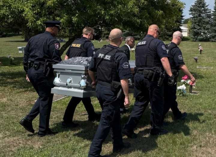 GRPD escort mother of fallen officer to final resting place alongside son, late husband