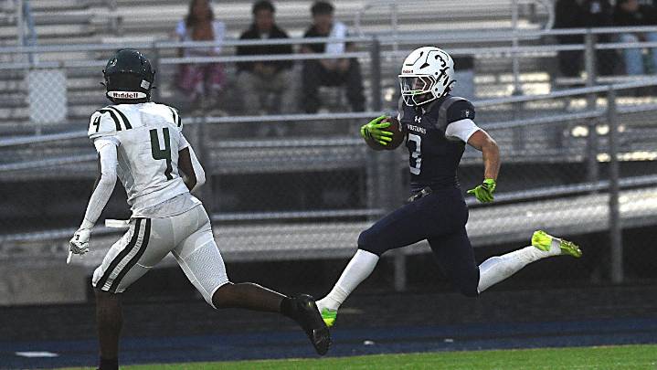 Faces in the crowd and game action as Damonte Ranch football defeats Hug