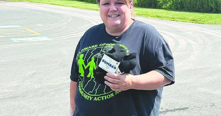 Delaware Opportunities distributes socks across the community