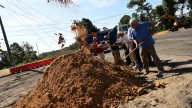 Scenes from roundabout groundbreaking at River Road in…