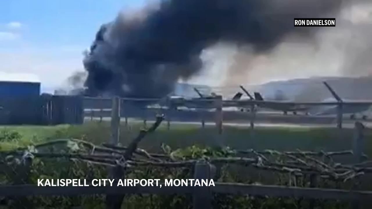 Plane crashes into parked aircraft while landing at Montana airport, sparking fire