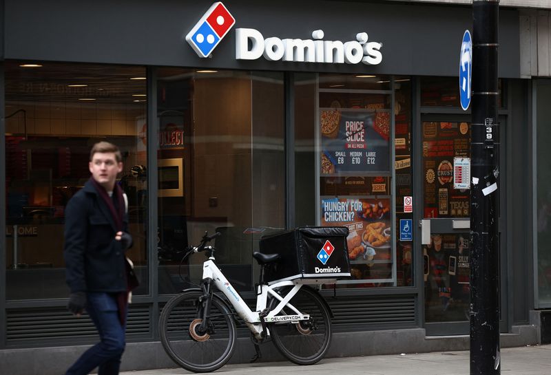 Australia's Domino's Pizza swings to annual loss, shares fall