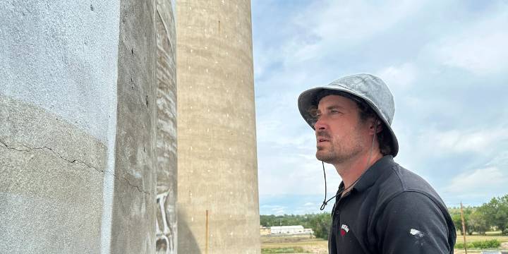 An Australian artist is painting huge murals on silos in the US Midwest