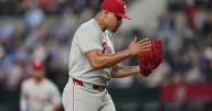 Phillies sweep Rangers with 4