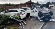 Carnage as driver flips hatchback, ploughs into lamppost and wipes out TWO parked cars