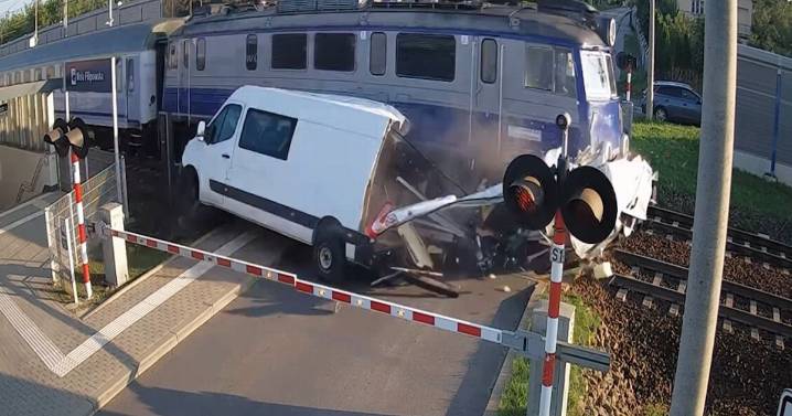Incredible moment train smashes into van on level crossing