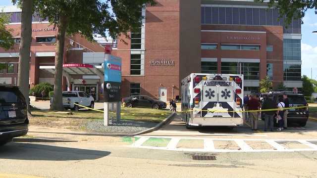Person of interest identified after man found dead, wrapped in blankets in car at hospital