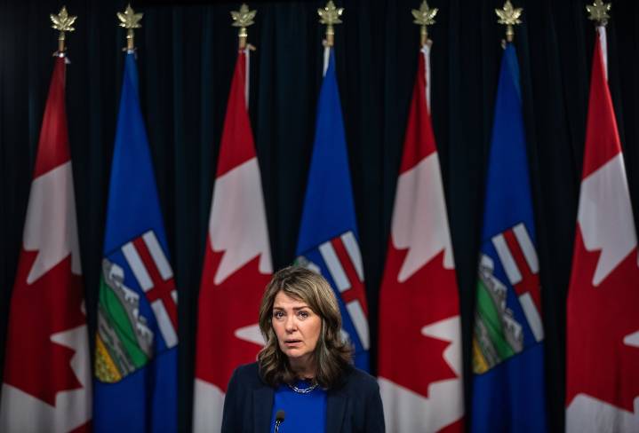Premier Danielle Smith defends new COVID shot administration fee during radio show
