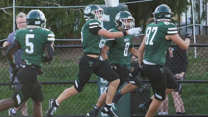 Trinity football, sparked by stout defense, handles Douglass in Class 6A tilt
