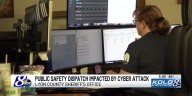 Public Safety Dispatchers take handwritten notes following cyber attack