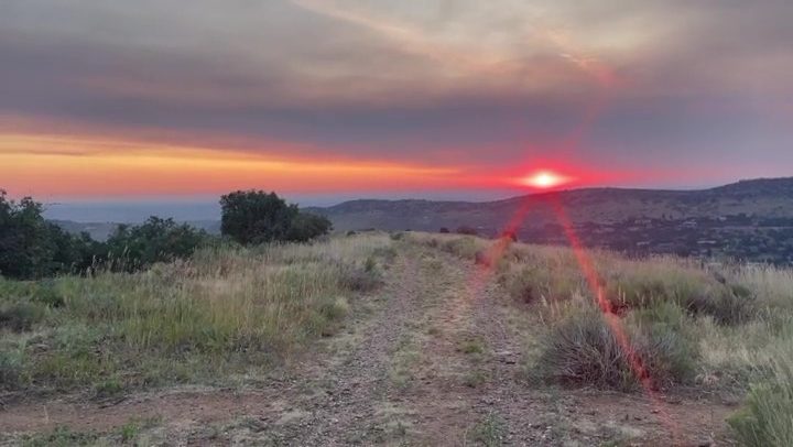 Why do wildfires make sunsets more colorful?