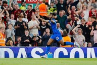 Late goals, Jota tributes and racism claim as Liverpool wins Premier League opener