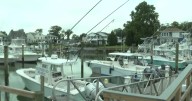 Boat owners prepare for high winds and changing tides at Virginia Beach marina
