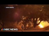 New wildfire prompts evacuations in Los Angeles as dozens rage out west