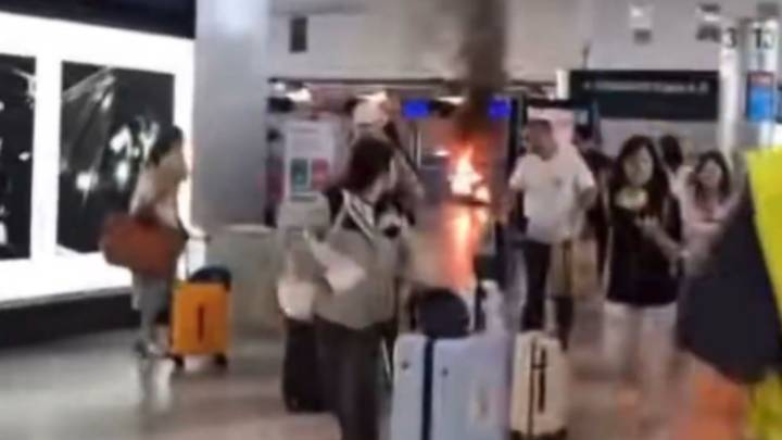 Hammer attacker sets airport check-in desk on FIRE sparking evacuation as passengers flee Milan’s Malepensa Airport
