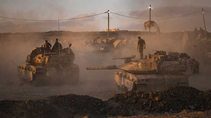 Israel starts Gaza assault, approves West Bank plan
